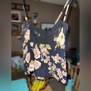 Billabong tank top it’s shorter in the back so cute size small black floral